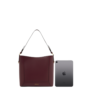 dark brown tote bag showing size comparison with tablet for storage capacity