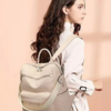 Woman carrying an elegant beige backpack purse with adjustable straps and modern minimalist designStylish women’s backpack purse designed with spacious compartments, premium leather-texture finish, and versatile carry options for travel, shopping, office, and everyday fashion use.Stylish women’s backpack purse designed with spacious compartments, premium leather-texture finish, and versatile carry options for travel, shopping, office, and everyday fashion use.
