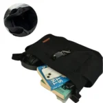 Black canvas messenger bag with spacious compartments holding books, phone, headphones, and daily essentials