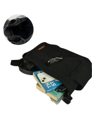 Black canvas messenger bag with spacious compartments holding books, phone, headphones, and daily essentials