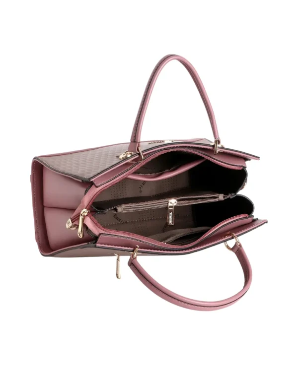 Elegant pink structured handbag for women carried by a model, featuring dual top handles, detachable shoulder strap, textured finish, and gold-tone hardware.