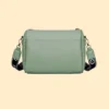 Stylish mint green women’s sling bag with pearl chain detailing, spacious inner compartments, secure zipper closure, and organized storage pockets. Perfect trendy crossbody handbag for daily use and travel.