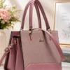 Premium pink structured handbag for women with dual handles, detachable shoulder strap, textured finish, and spacious compartments for daily use.
