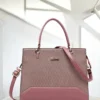Premium pink structured handbag for women with textured finish, detachable shoulder strap, dual handles, and elegant gold-tone details.