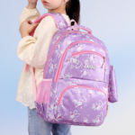 Pink kids school backpack with cartoon print and side pouch for girls