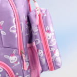 Close-up view of purple kids backpack side pouch with cute bunny print