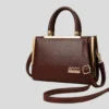Luxury brown women handbag with gold detailing and adjustable shoulder strap